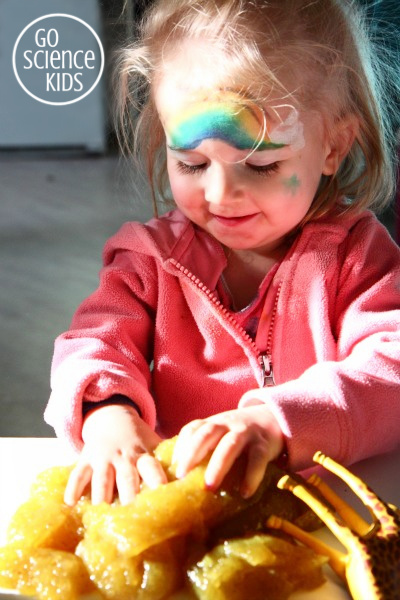 Toddler playing with slime