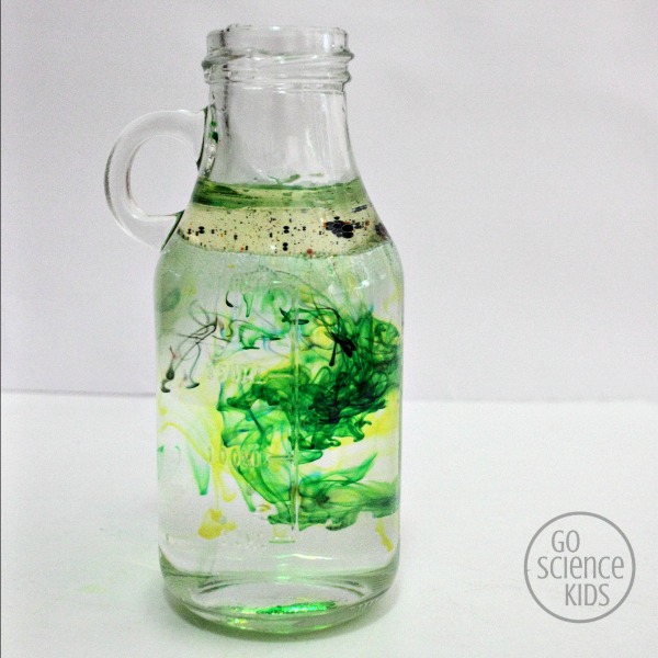 Green and yellow swirls - fireworks in a jar science project for kids