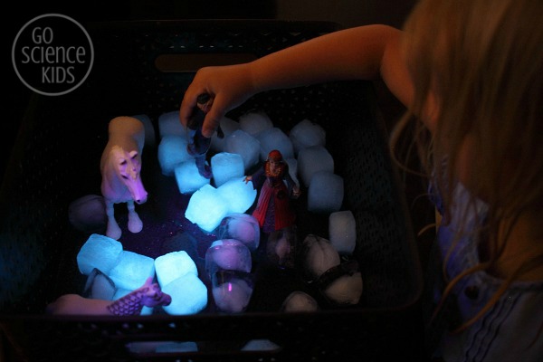 Glowing sensory play with fluorescent ice