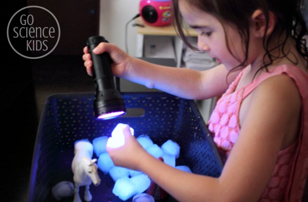 investigating glowing tonic ice cubes with a UV flashlight - fun science play for kids