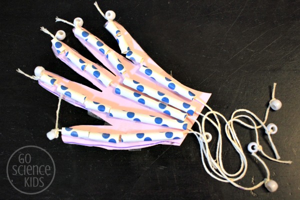 Creating an articulated hand model with craft foam, paper straws, string and beads