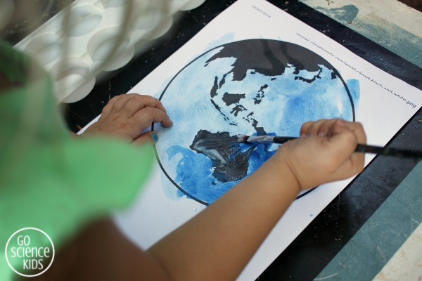 Planet earth craft for kids using real dirt to represent land. Fun craft for Earth Day