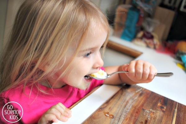 Tasting fresh homemade curds with honey drizzled on top