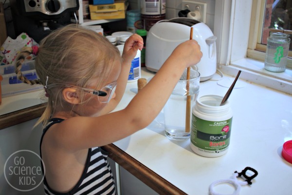 Stirring Borax into hot water